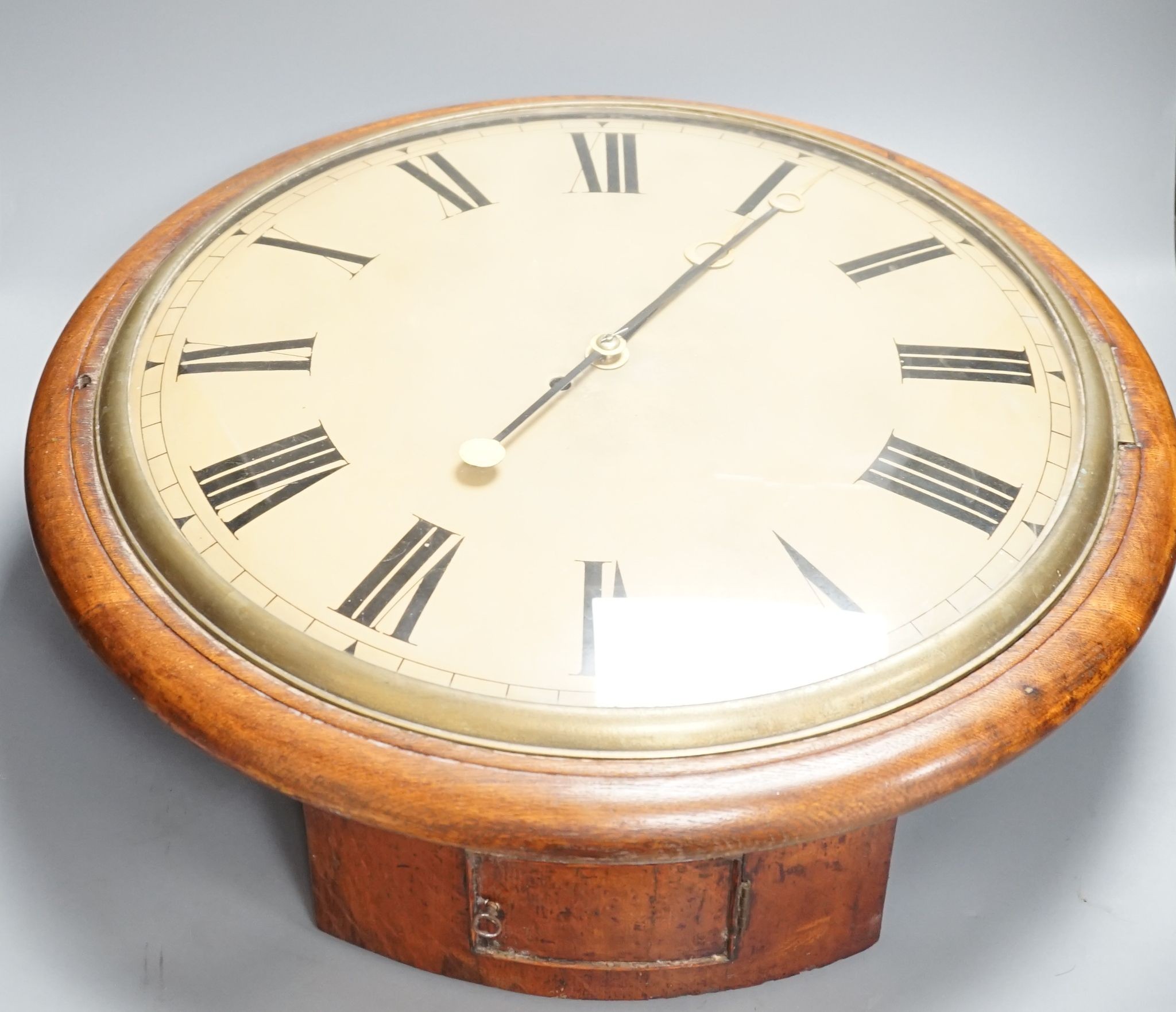 A large Victorian oak-cased dial clock, 56 cms diameter.